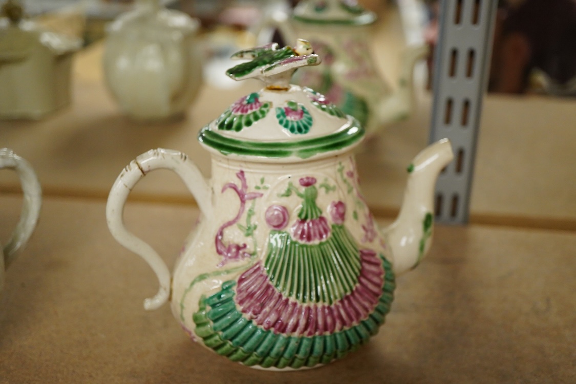 A rare Staffordshire saltglaze stoneware teapot, mid 18th century, an early 19th Wedgwood stoneware teapot and a stoneware butter tub and cover - 13cm wide (3)